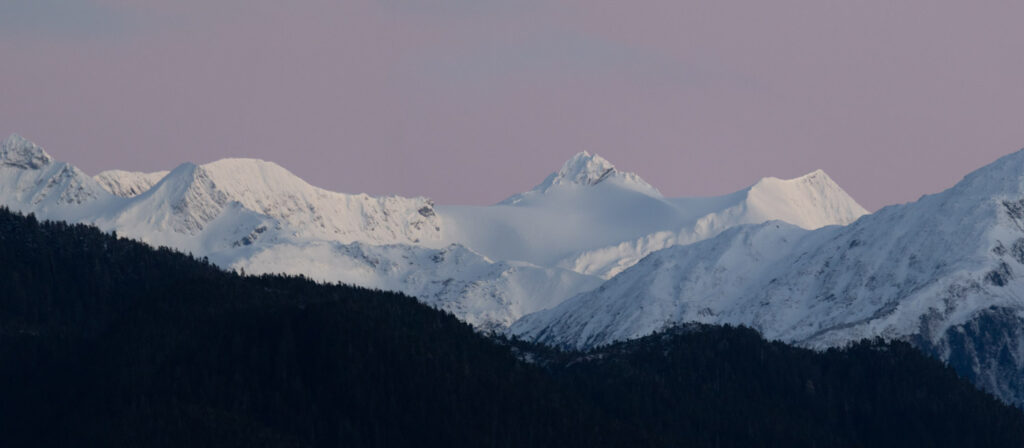 Post-sunset Light on Snow-covered Mountains