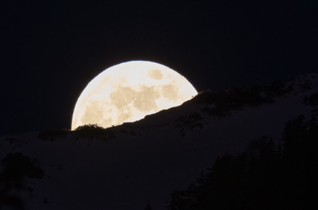 Moon Rising Behind Ridge