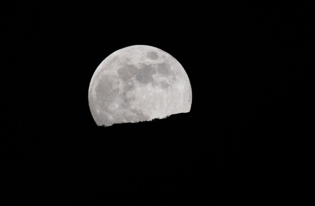 Moon Rising Behind Ridge